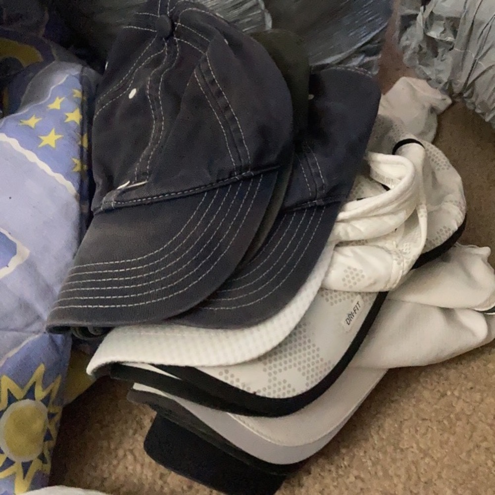 Stack of Nike hats
